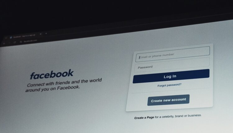 Facebook login screen on a computer monitor.